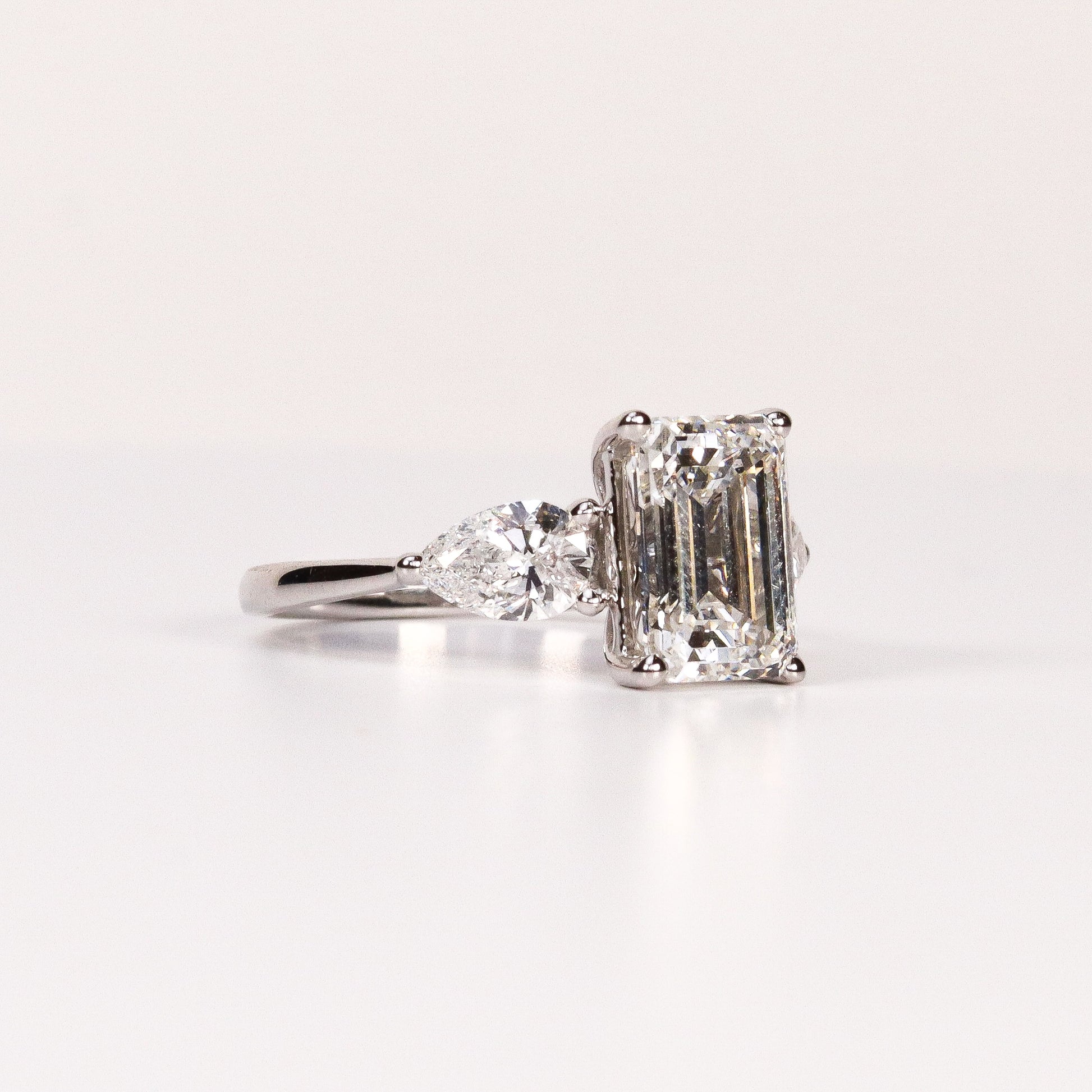 LAB-GROWN DIAMOND EMERALD-CUT & PEAR SIDE-STONE THREE-STONE ENGAGEMENT RING image 1