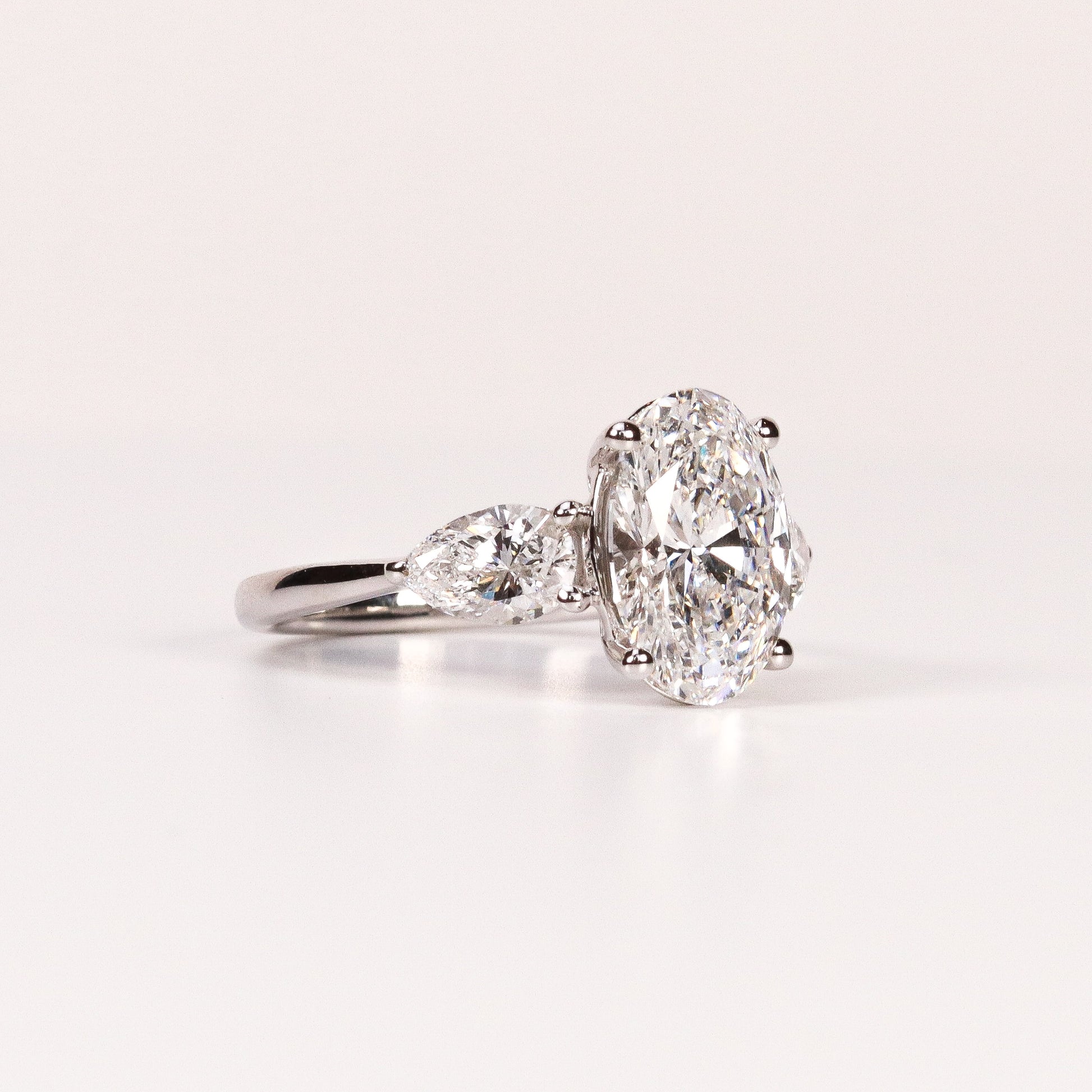 LAB-GROWN DIAMOND OVAL & PEAR SIDE-STONE THREE-STONE ENGAGEMENT RING image 1