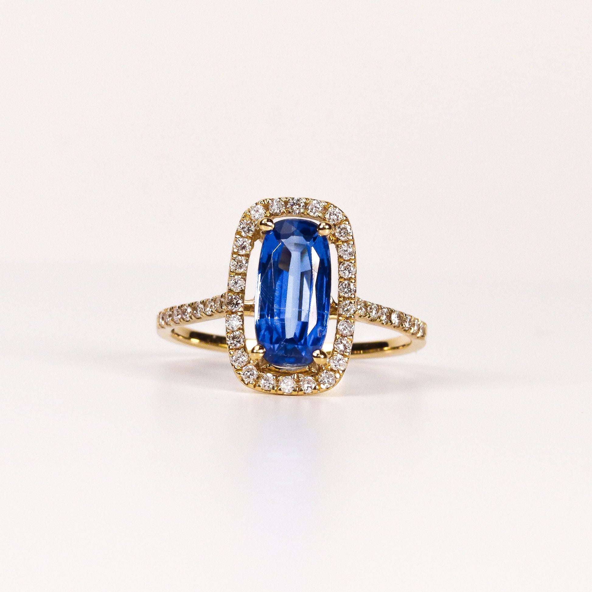 BLUE SAPPHIRE & DIAMOND ELONGATED CUSHION HALO RING image 0