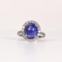 BLUE TOPAZ & DIAMOND OVAL CABOCHON HALO RING image 0
