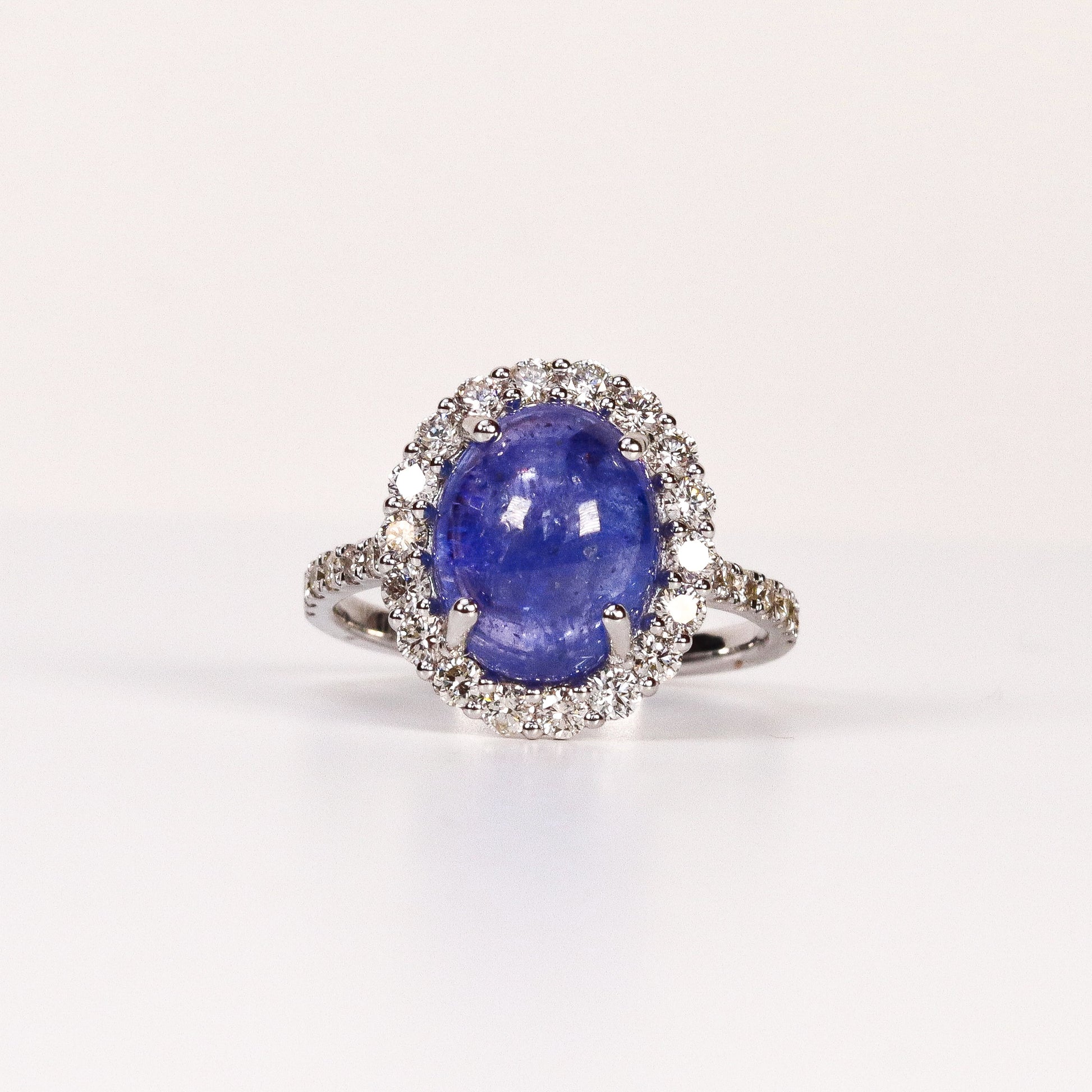 BLUE TOPAZ & DIAMOND OVAL CABOCHON HALO RING image 0
