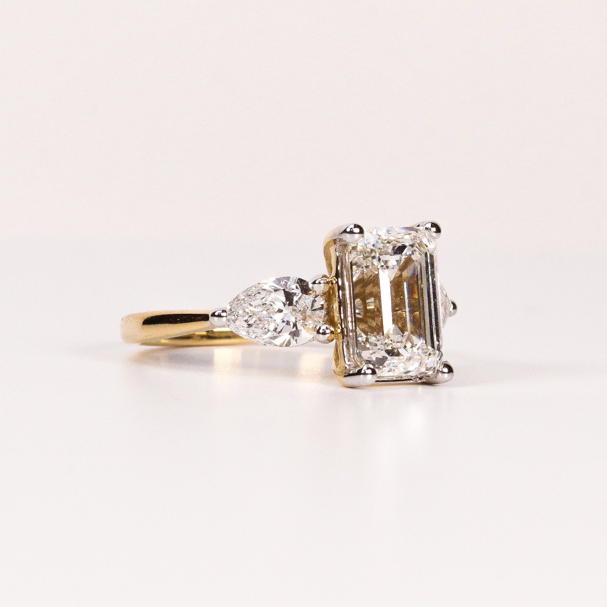 LAB-GROWN DIAMOND EMERALD-CUT & PEAR SIDE-STONE THREE-STONE ENGAGEMENT RING image 1