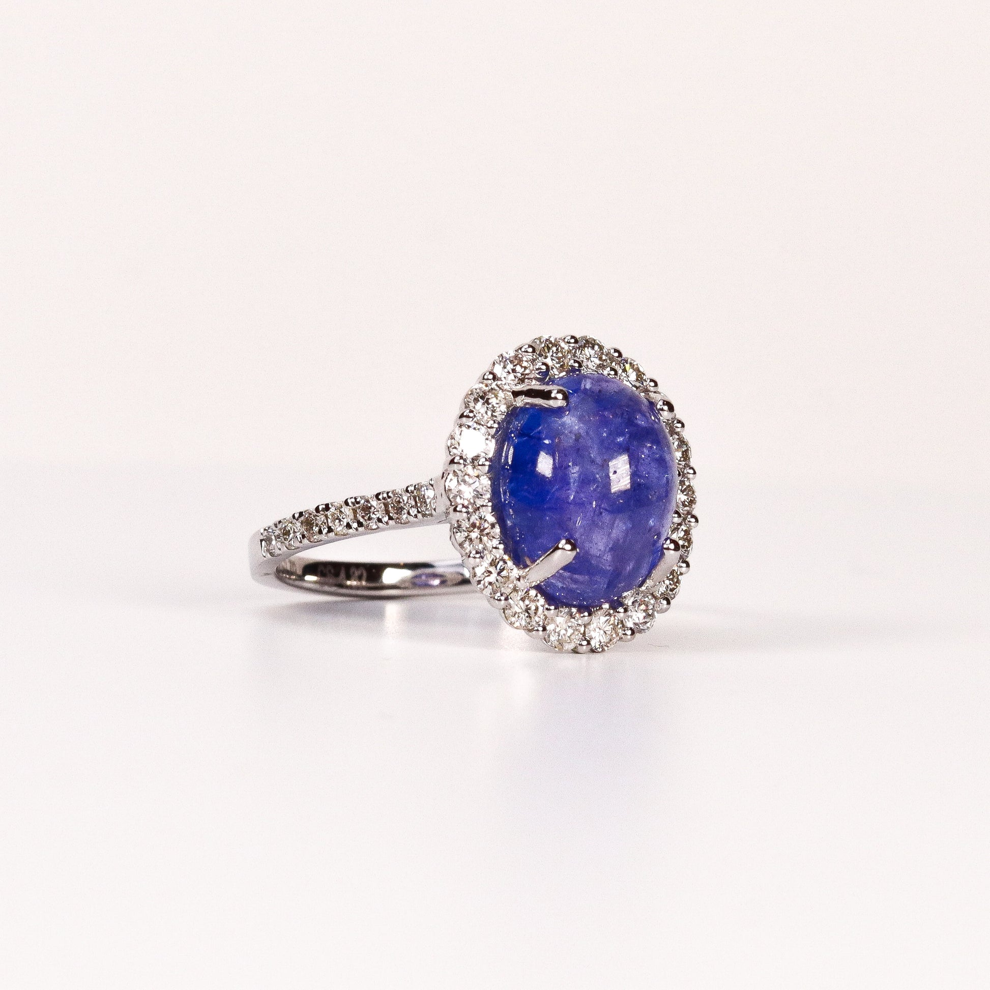 BLUE TOPAZ & DIAMOND OVAL CABOCHON HALO RING image 1